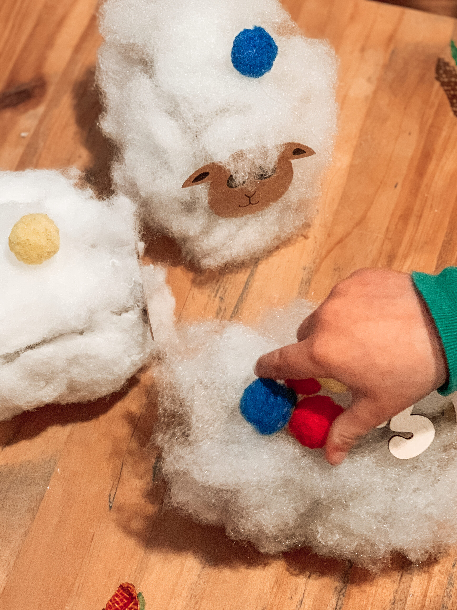 Kids playing with toilet paper roll sheep craft