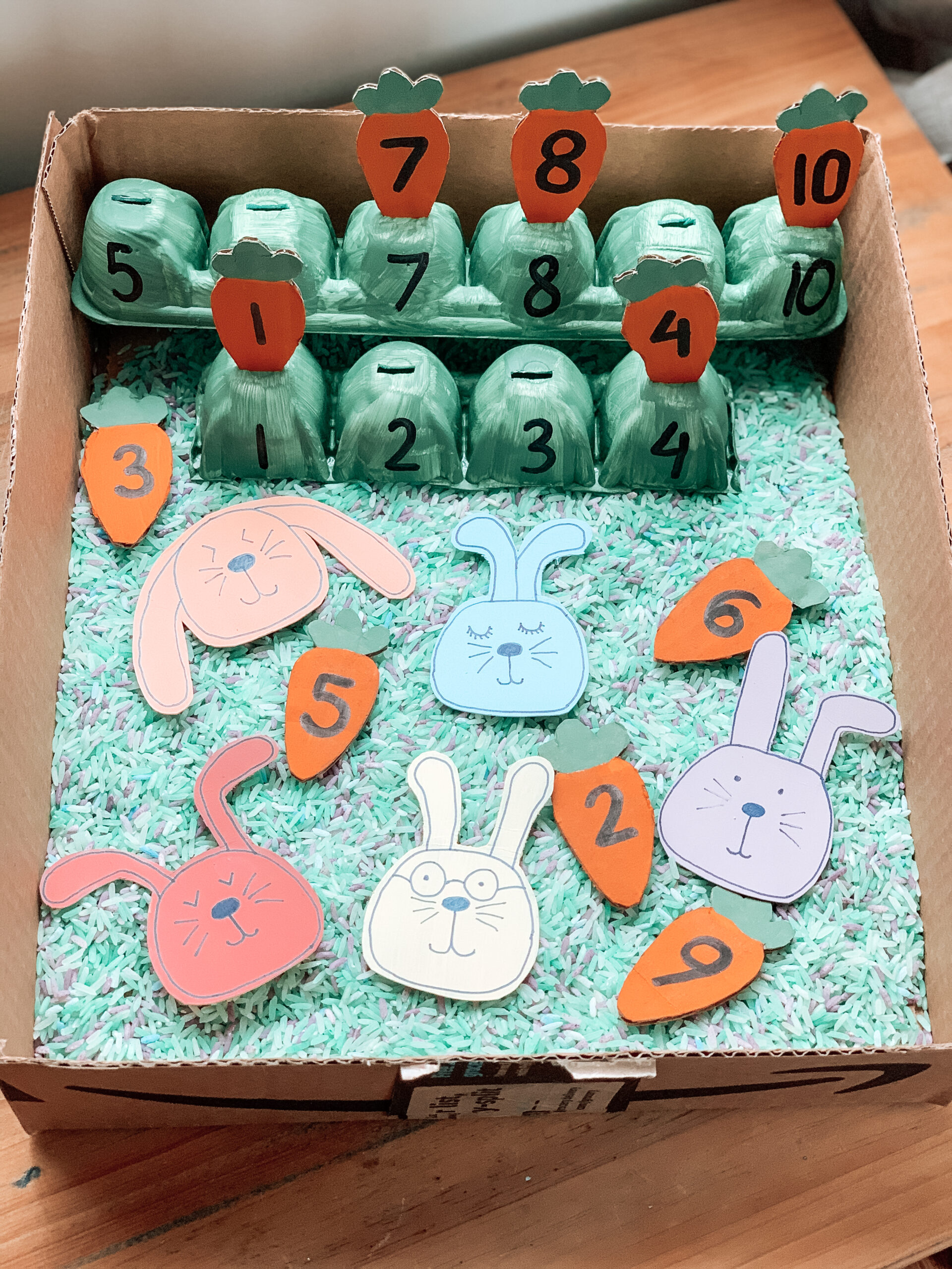 Bunny and carrot spring sensory play bin for kids
