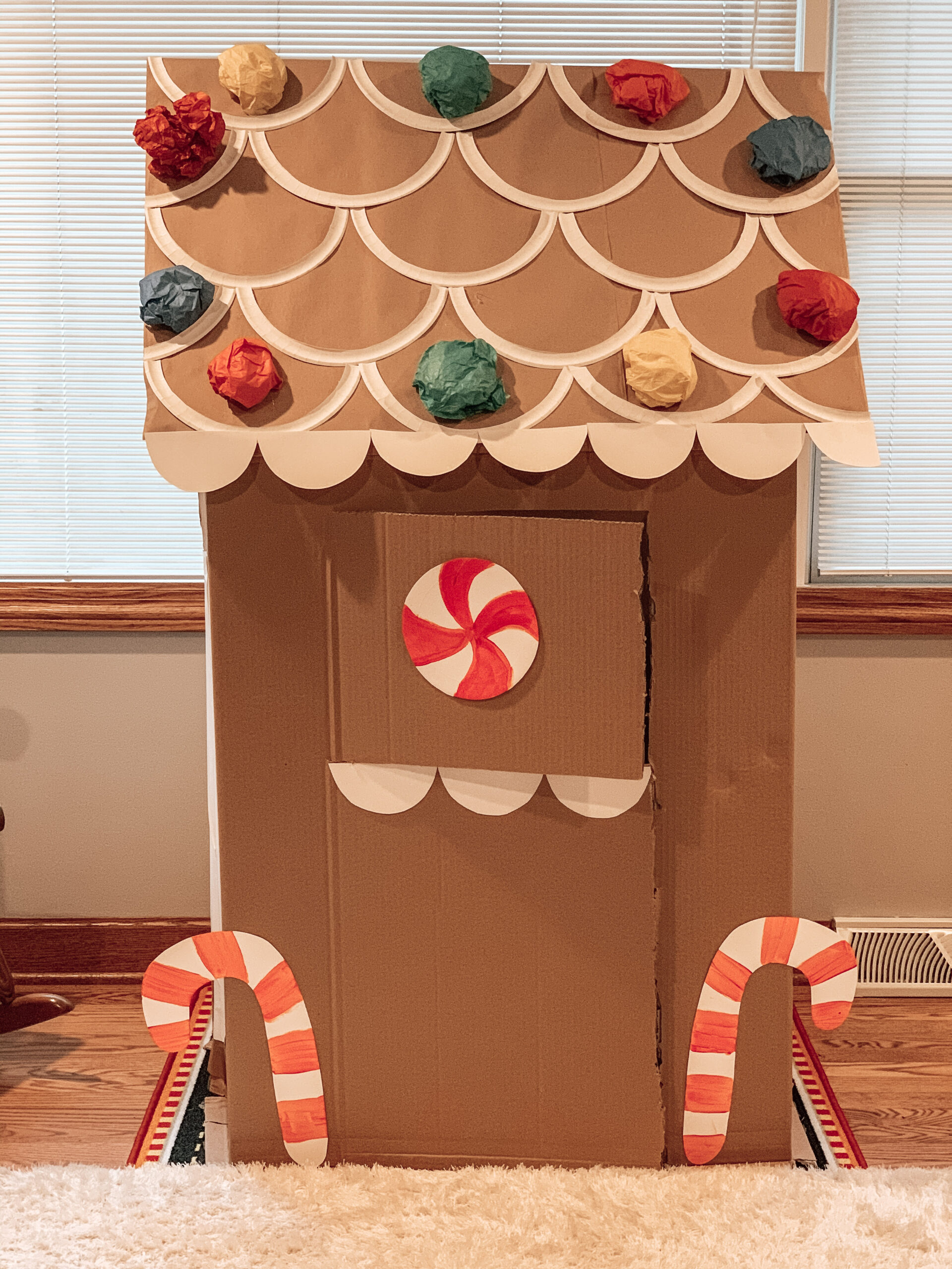 Completed repurposed cardboard box gingerbread house. A cardboard activity for kids to play with