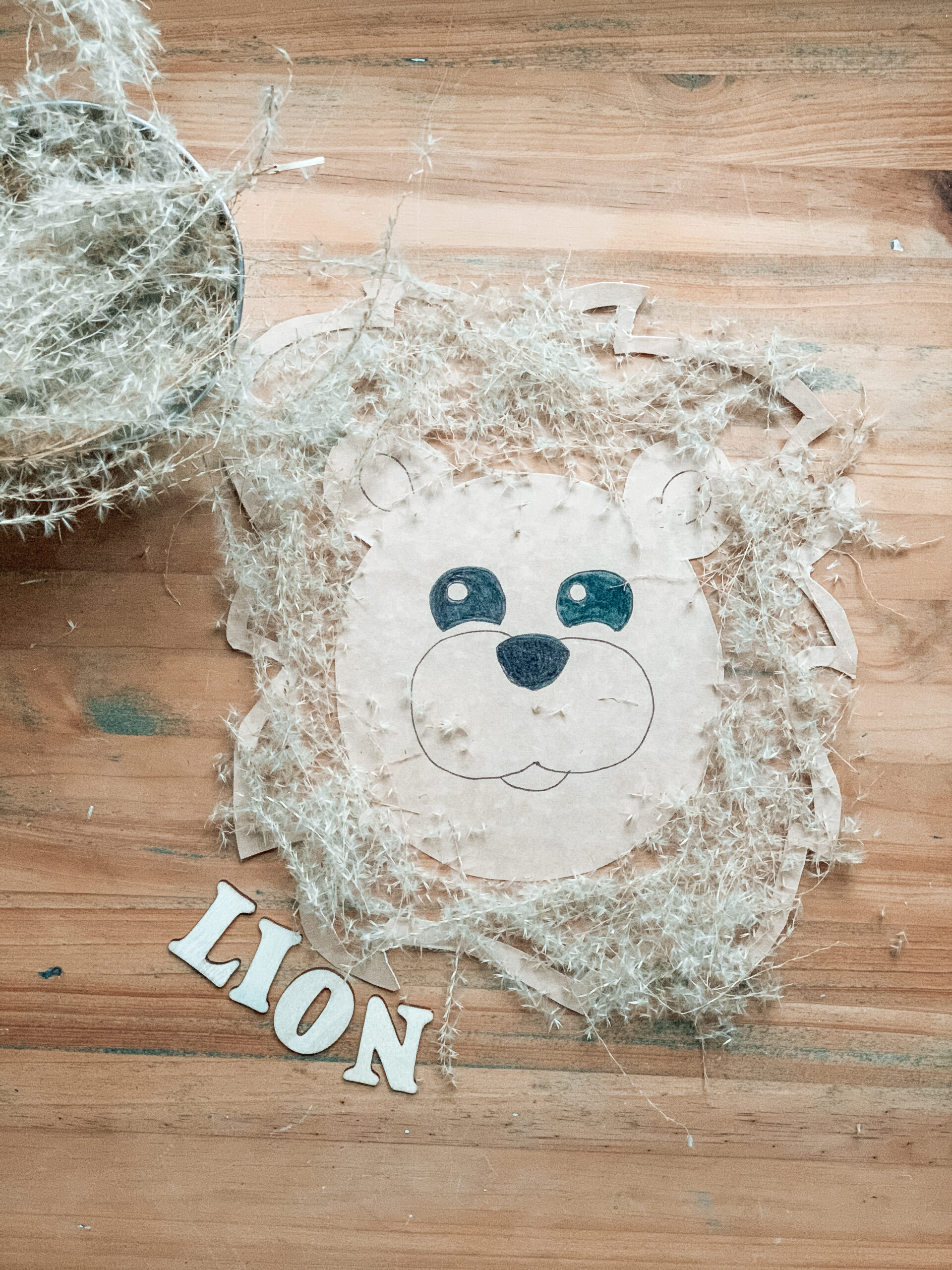 Kids nature lion craft made of repurposed cardboard and contact paper